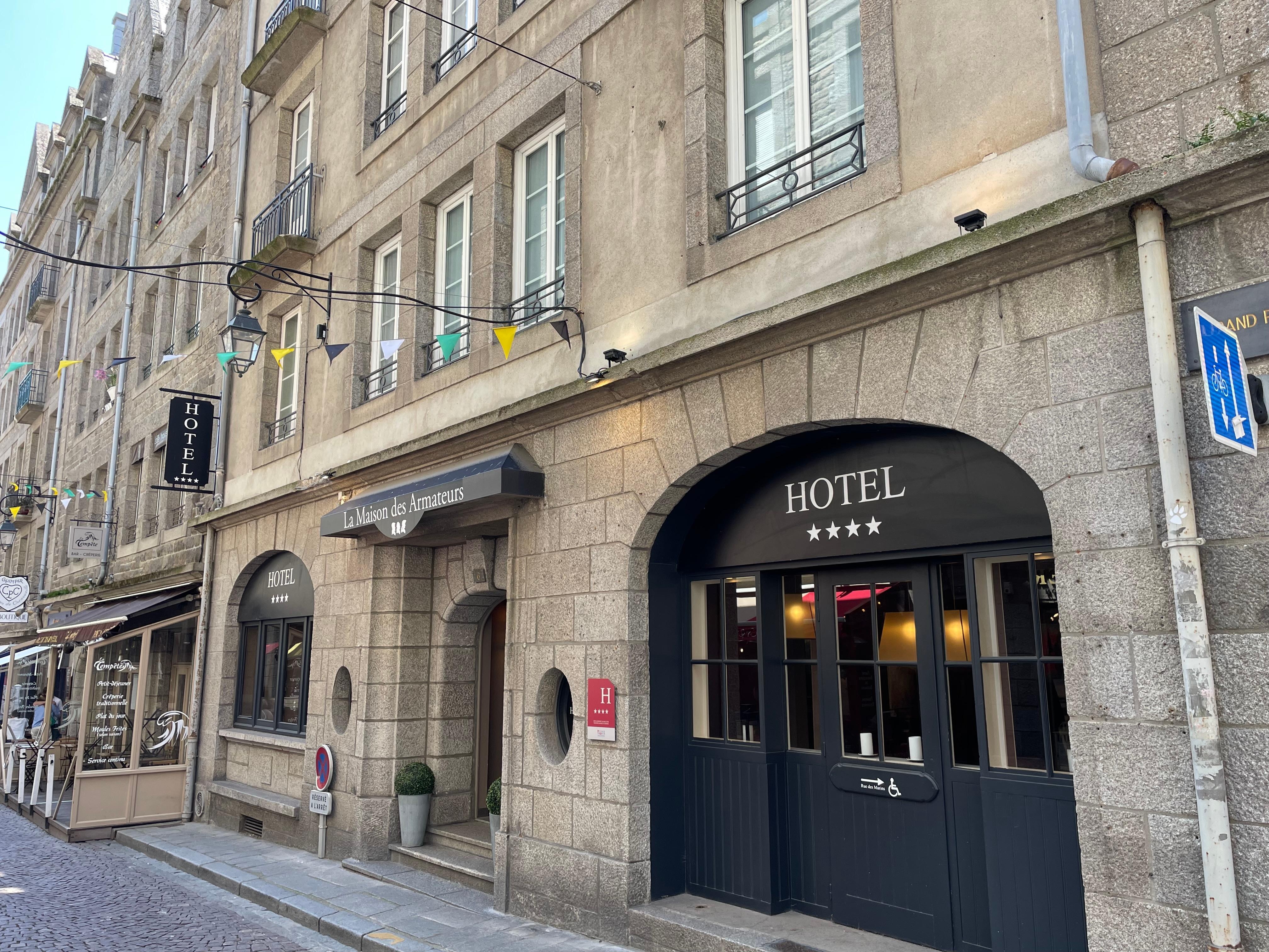 A short walk from two gates in the old town wall, close to many excellent restos. 