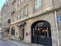 A short walk from two gates in the old town wall, close to many excellent restos.