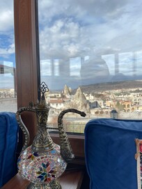 Indoor common room with fireplace, great view and lovely place to enjoy the free coffee/the from the roof top restaurant