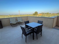 Large private patio with view of vineyar