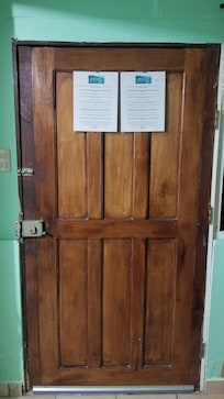 Solid wood door that looks nice and secure.