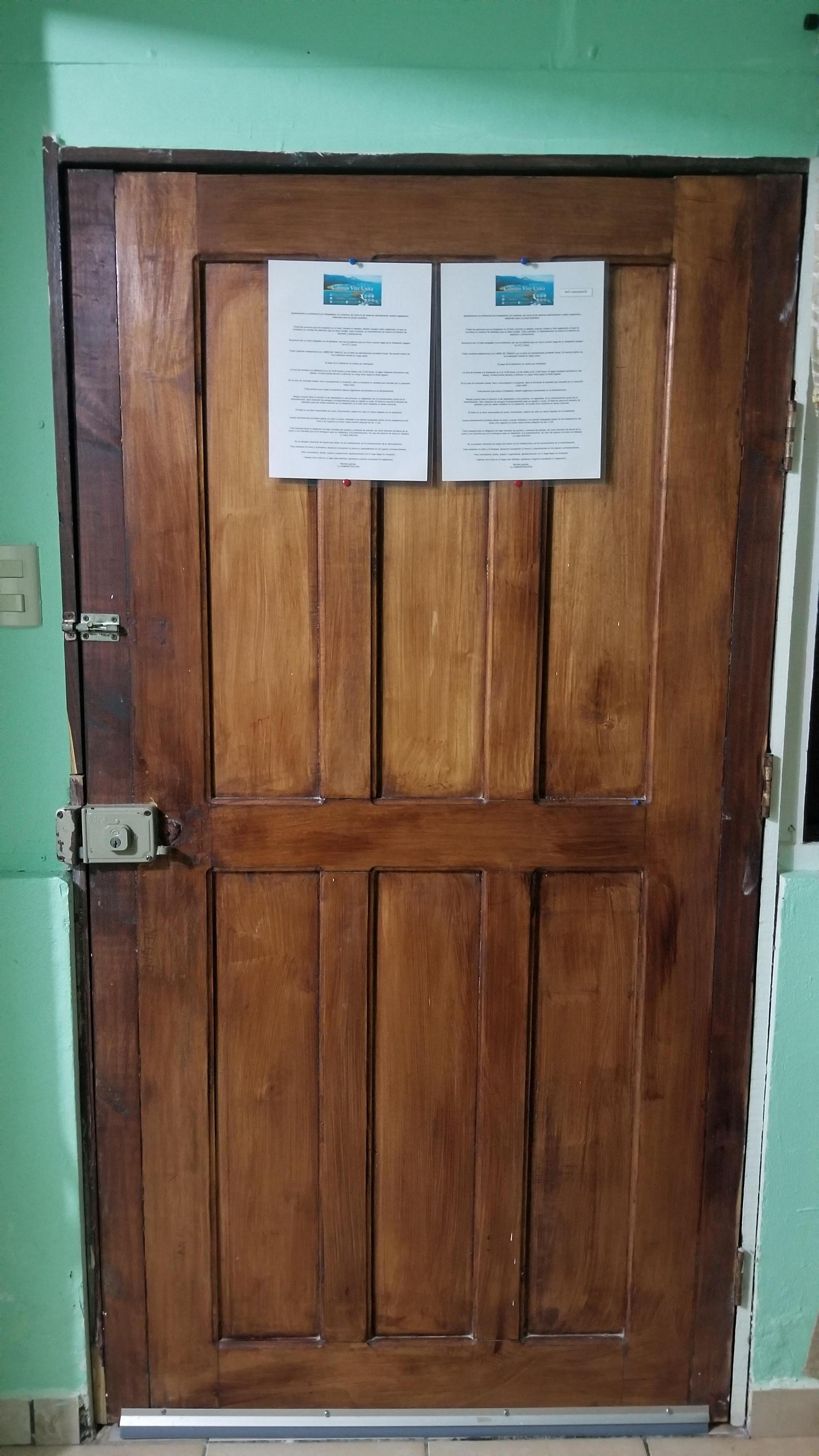 Solid wood door that looks nice and secure.