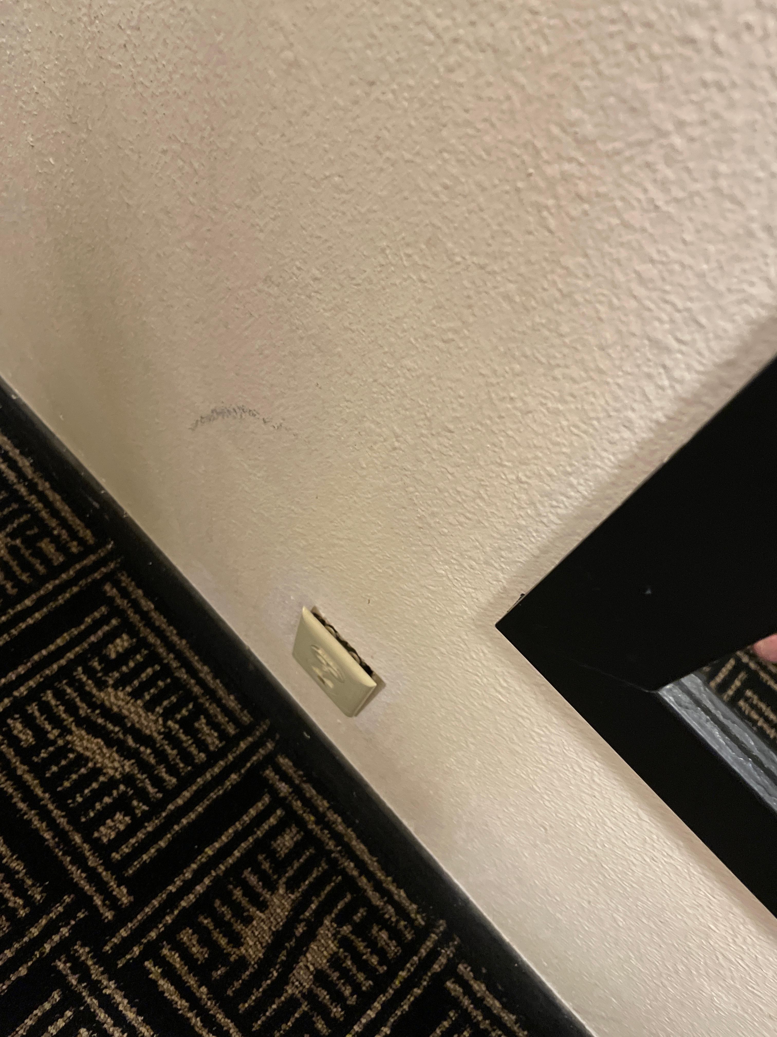 Electric outlet coming out of the wall
