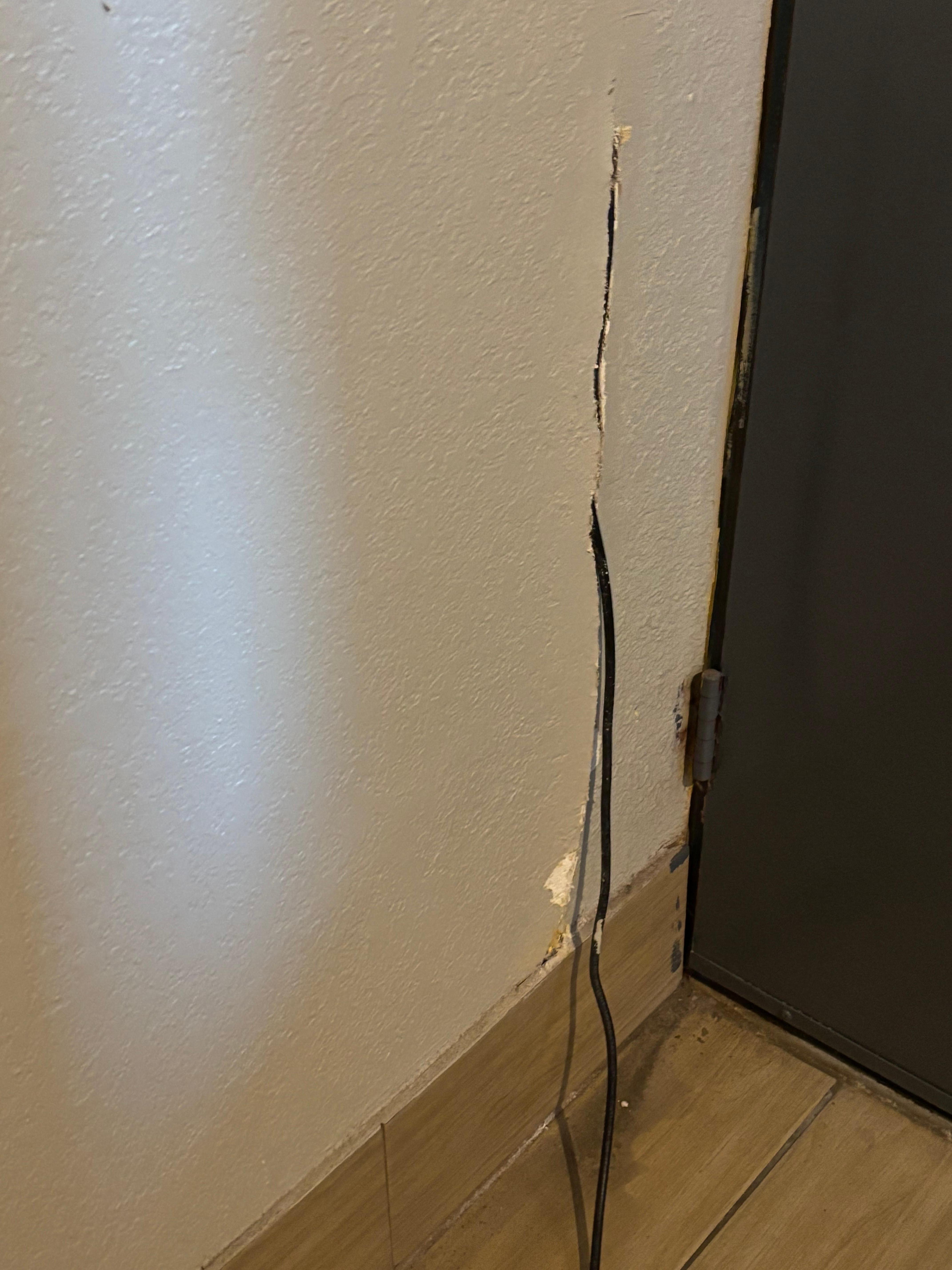 The cable cord cut into the wall