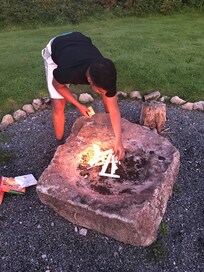 Keeping the camp fire alight.