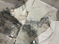 Floor so cracked the edge of the tiling cuts your feet