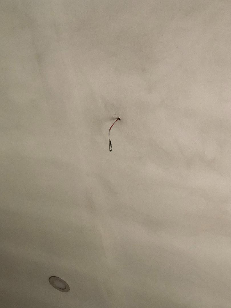 Random exposed wire above the bed