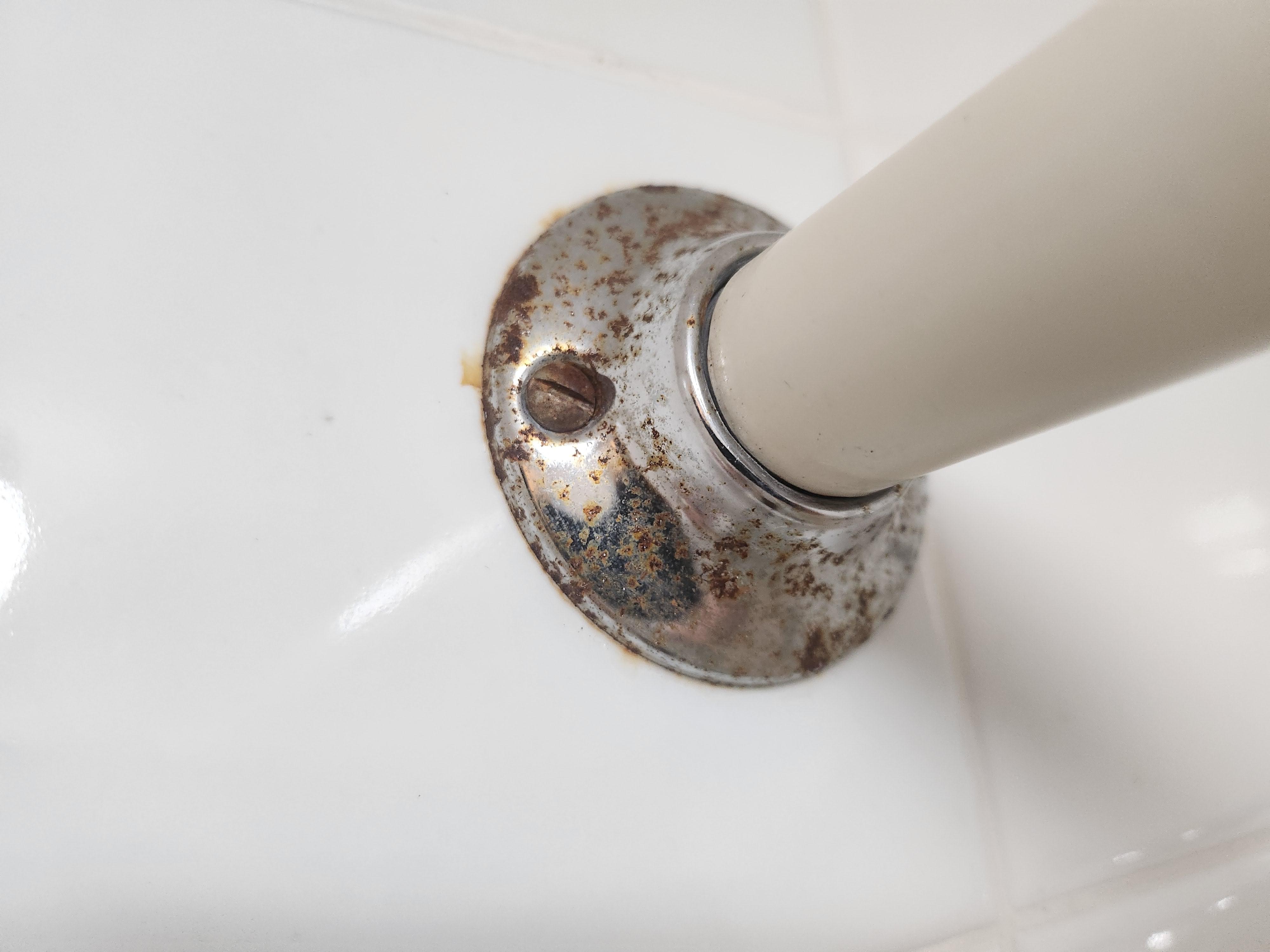 Rusty shower curtain mounts.