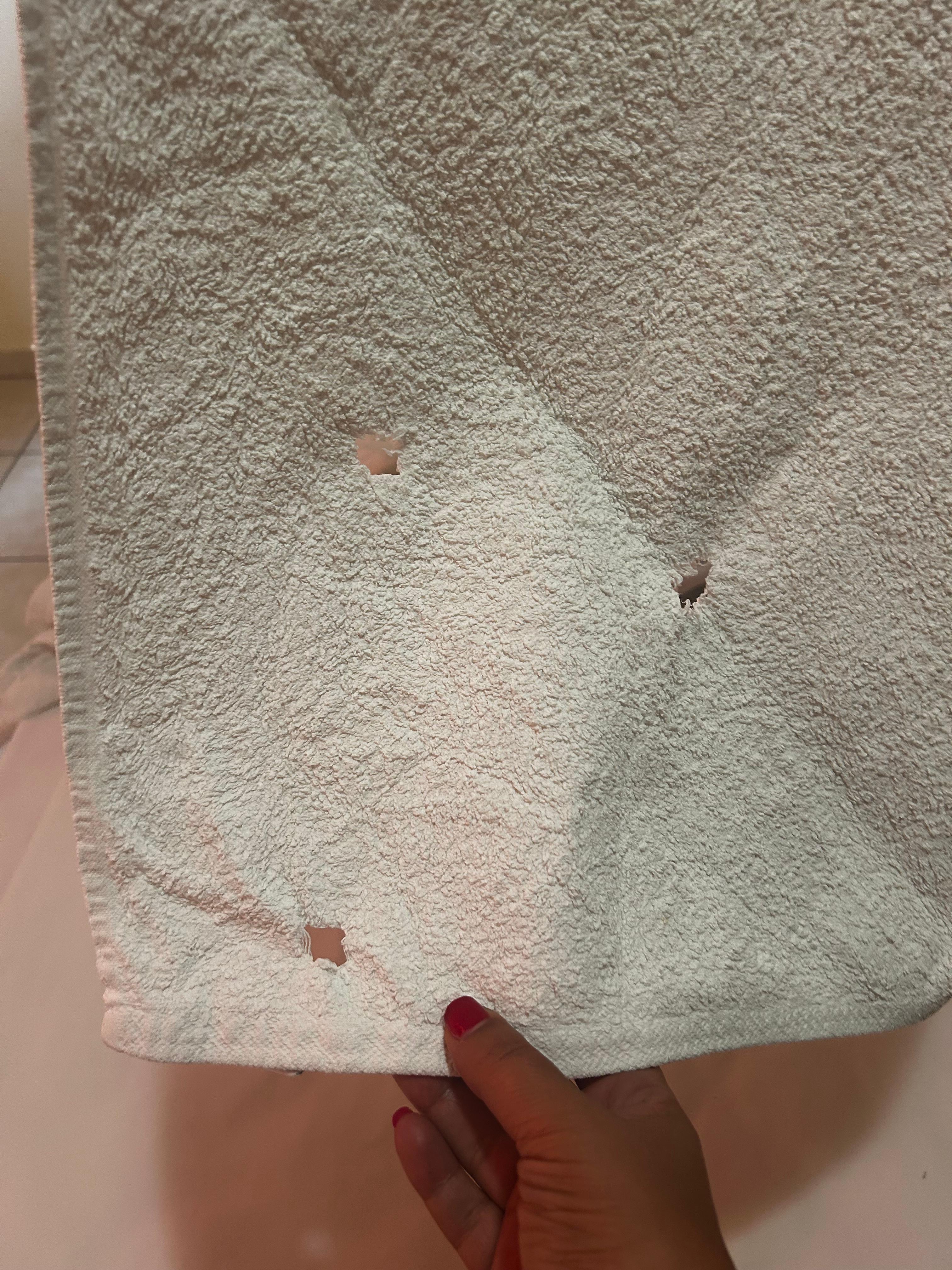 Towels with holes and stains 