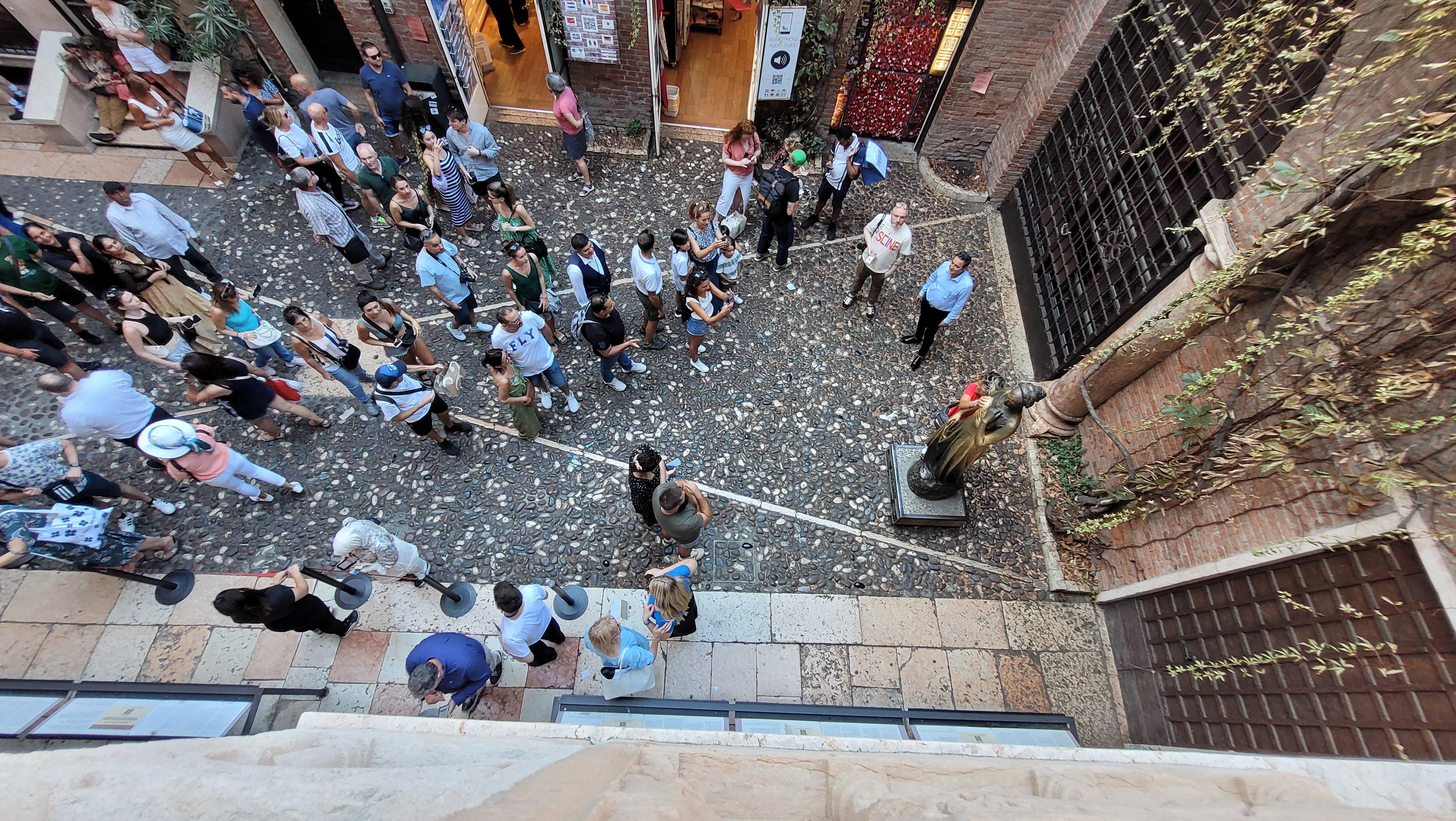 Crowds gather under Juliet's balcony to sexually harass a 13 year-old suicide.