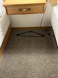 Hanger was broken and left on the floor by the housekeeping