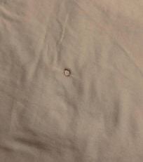 Cigarette burn hole in sheet