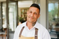 Waiter with huge smile. Both he and wife work in Hotel.