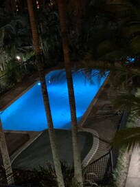 The view of the pool at night from our room