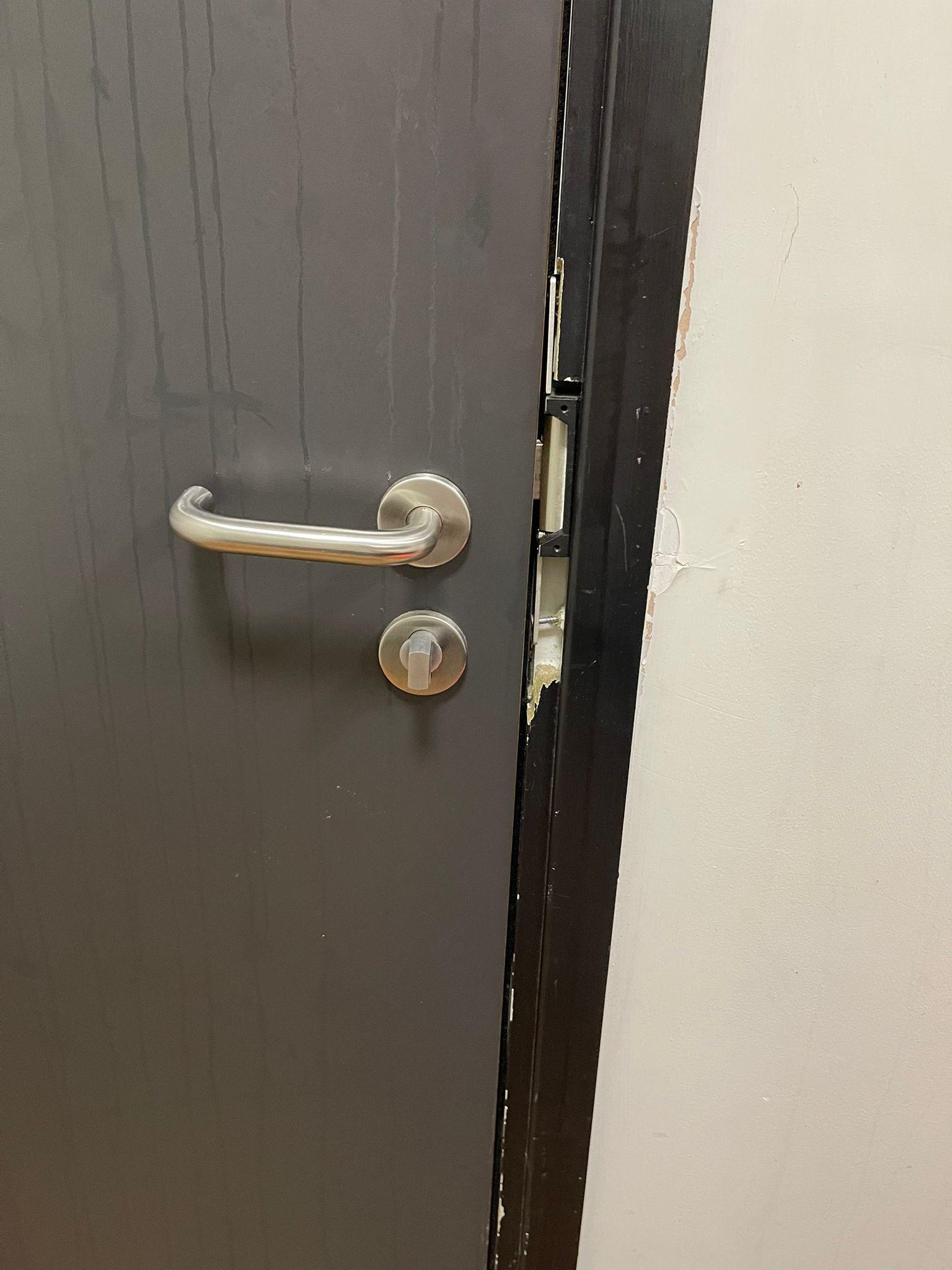 Faulty door lock and broken door frame