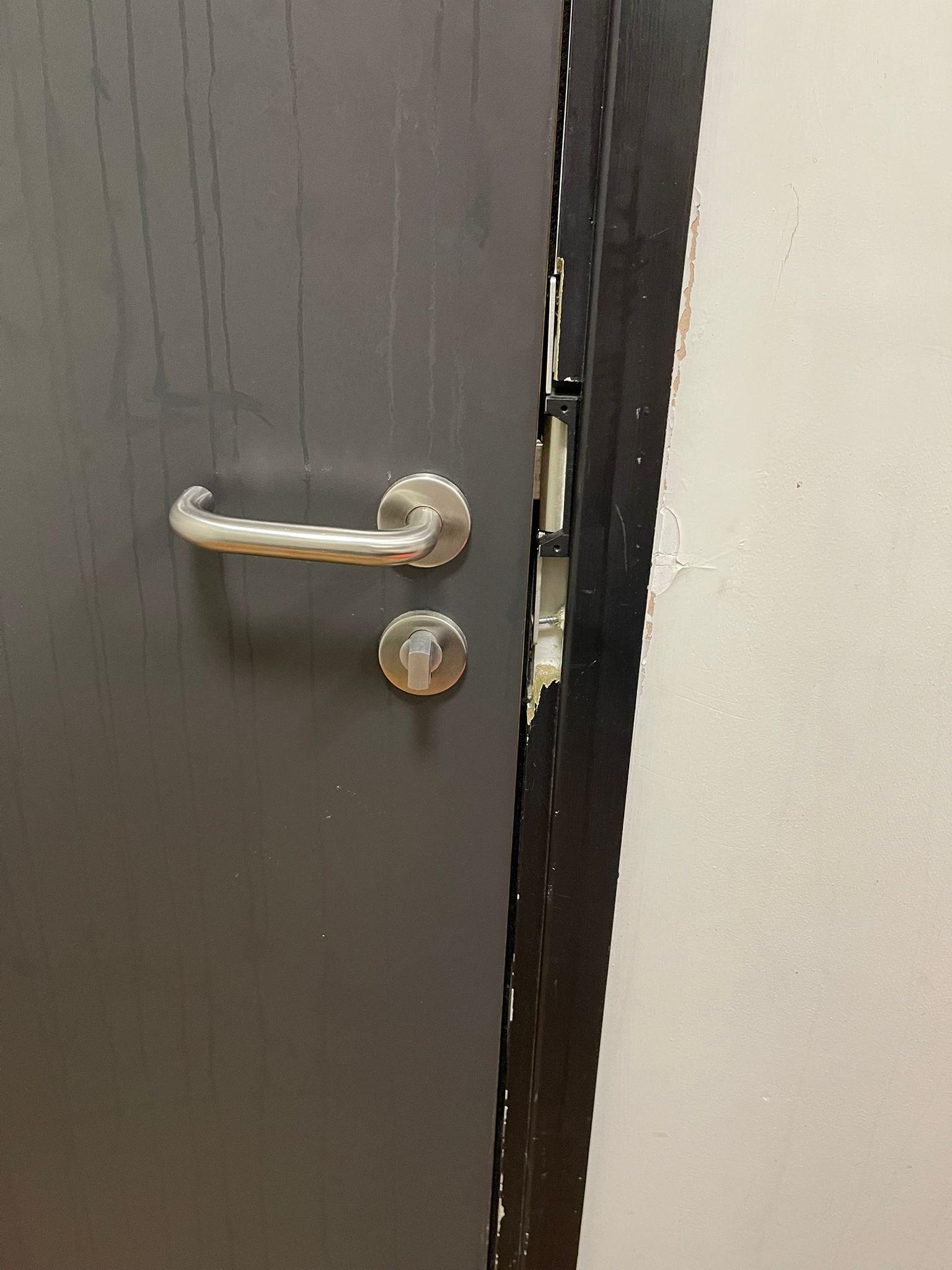Faulty door lock and broken door frame