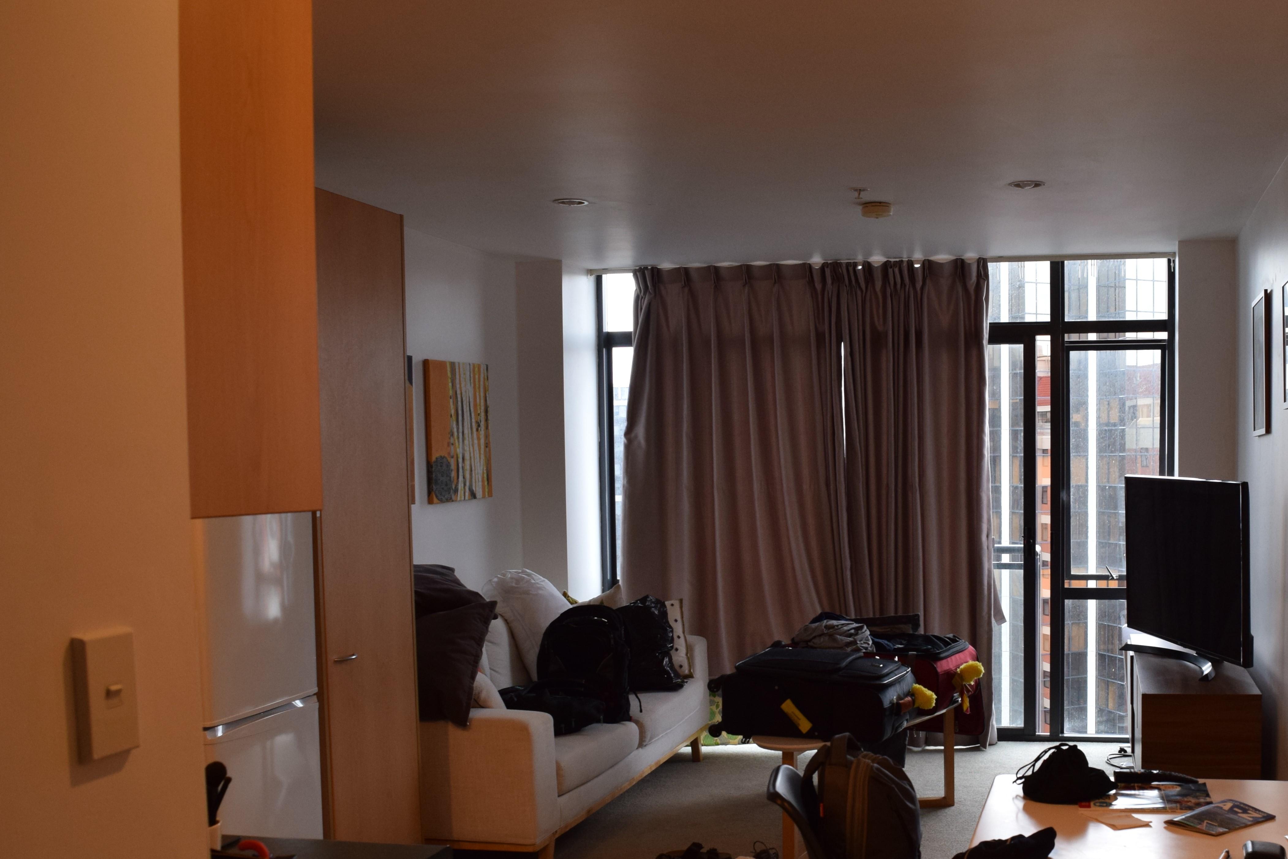 View of living room and balcony door.