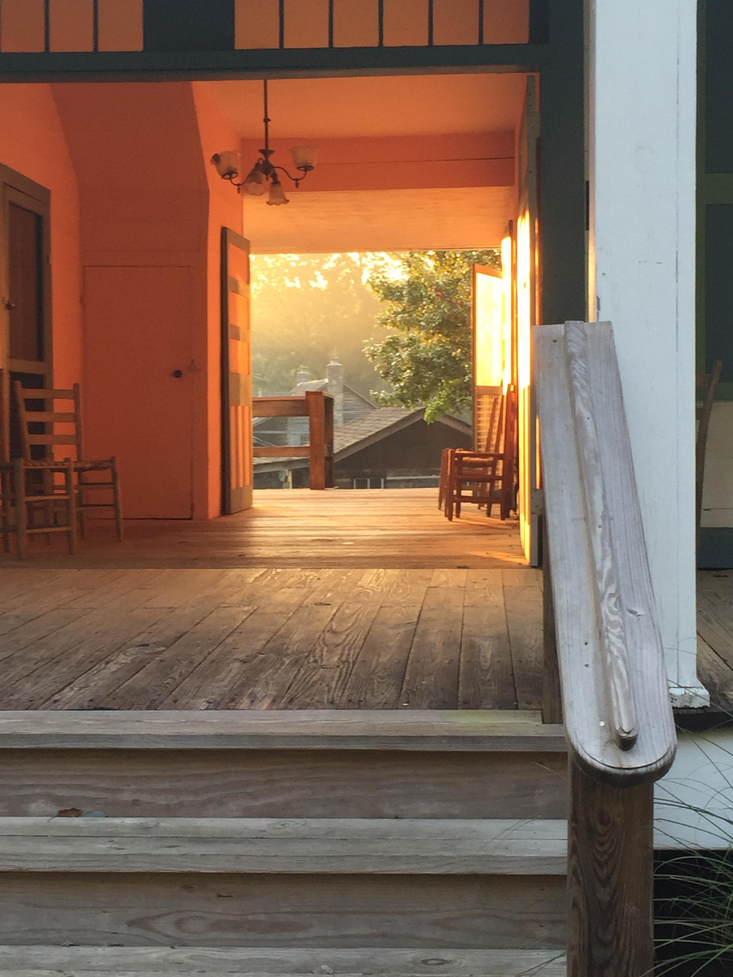 Early morning light through the breezeway of a historic home on the property