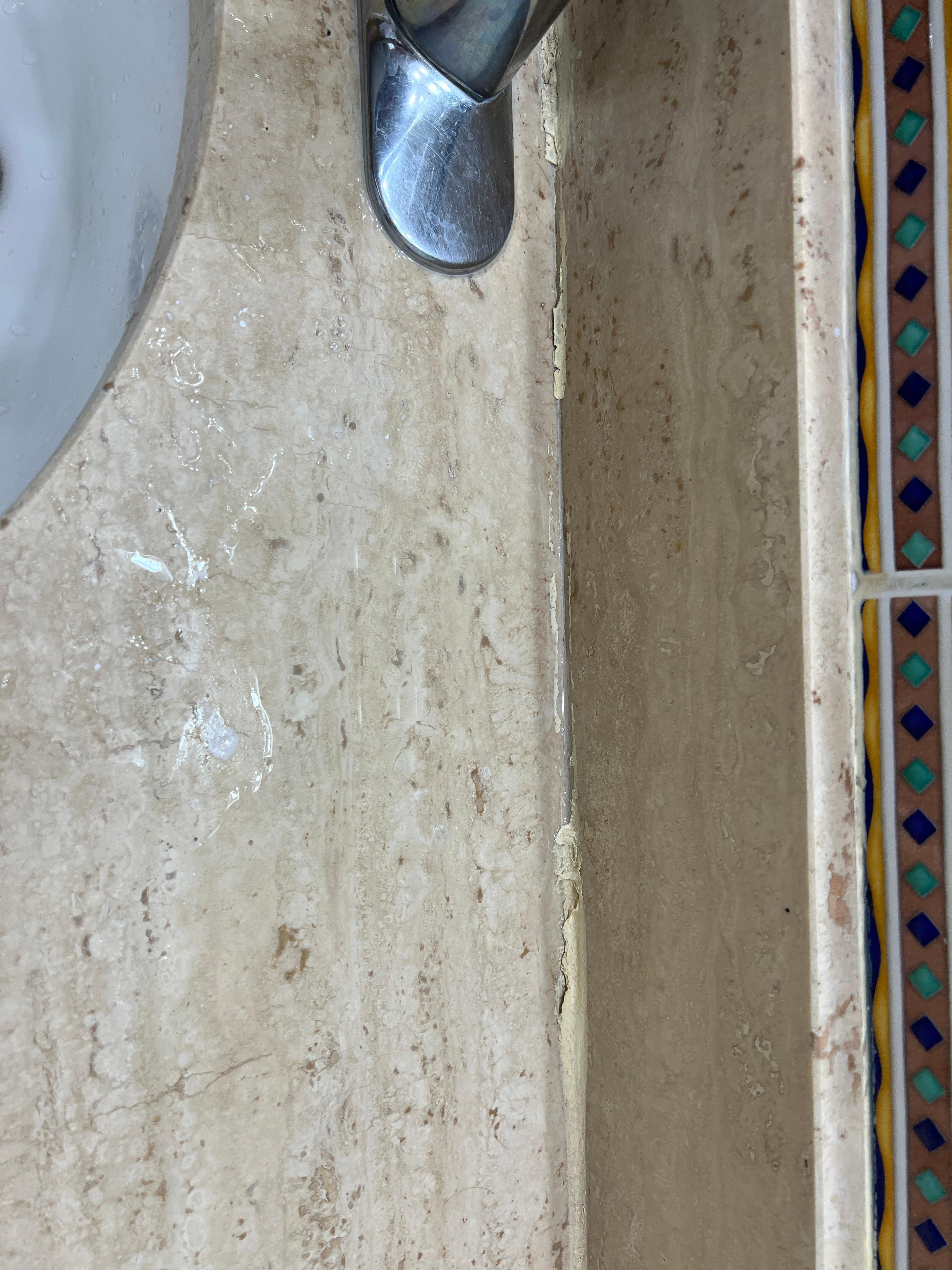 Peeling caulk all
Over tub and countertop 