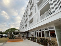 Exterior of the hotel with loads of parking