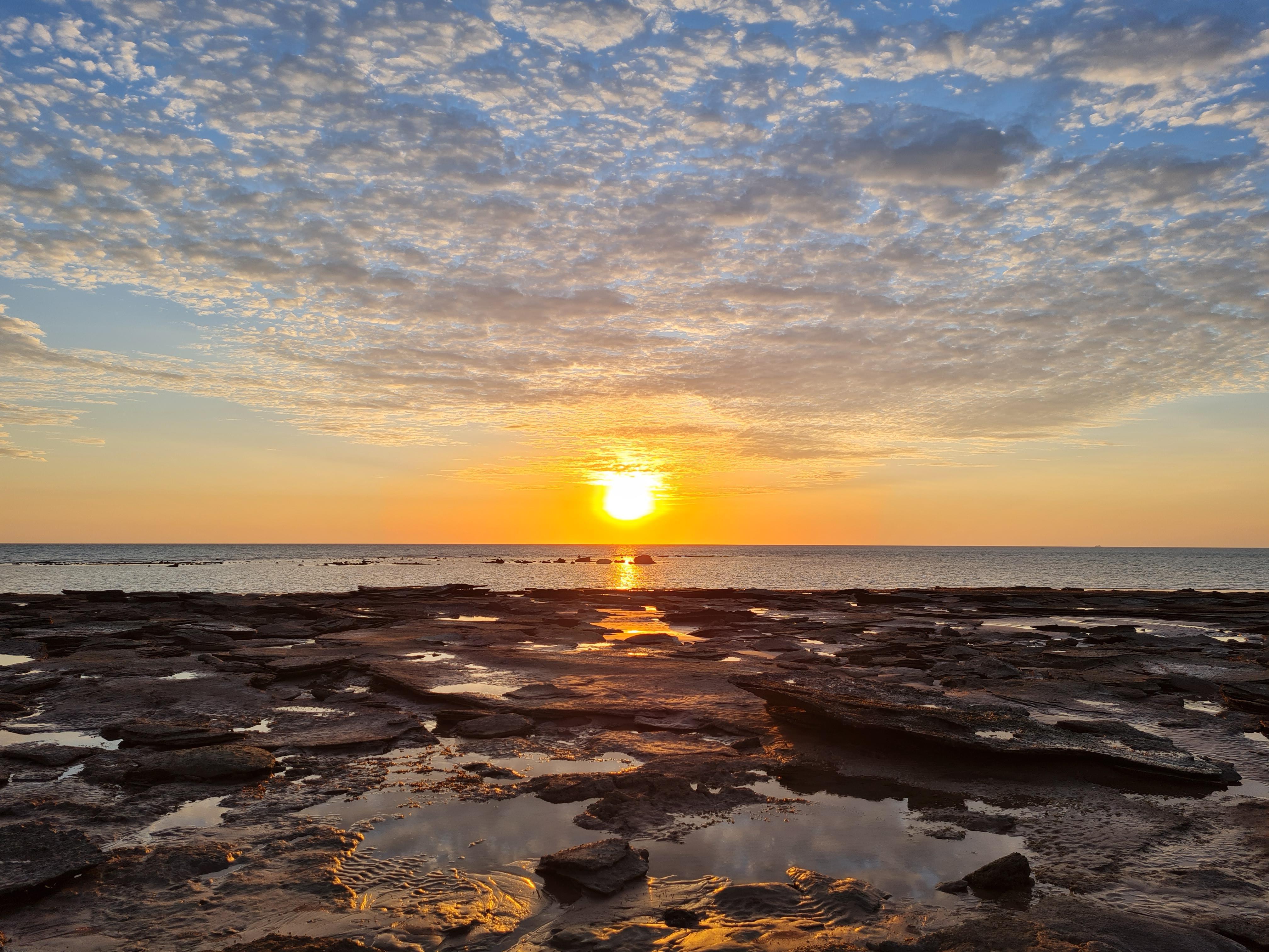 Sunset at Reddell Beach, low tide with Sauropod footprints