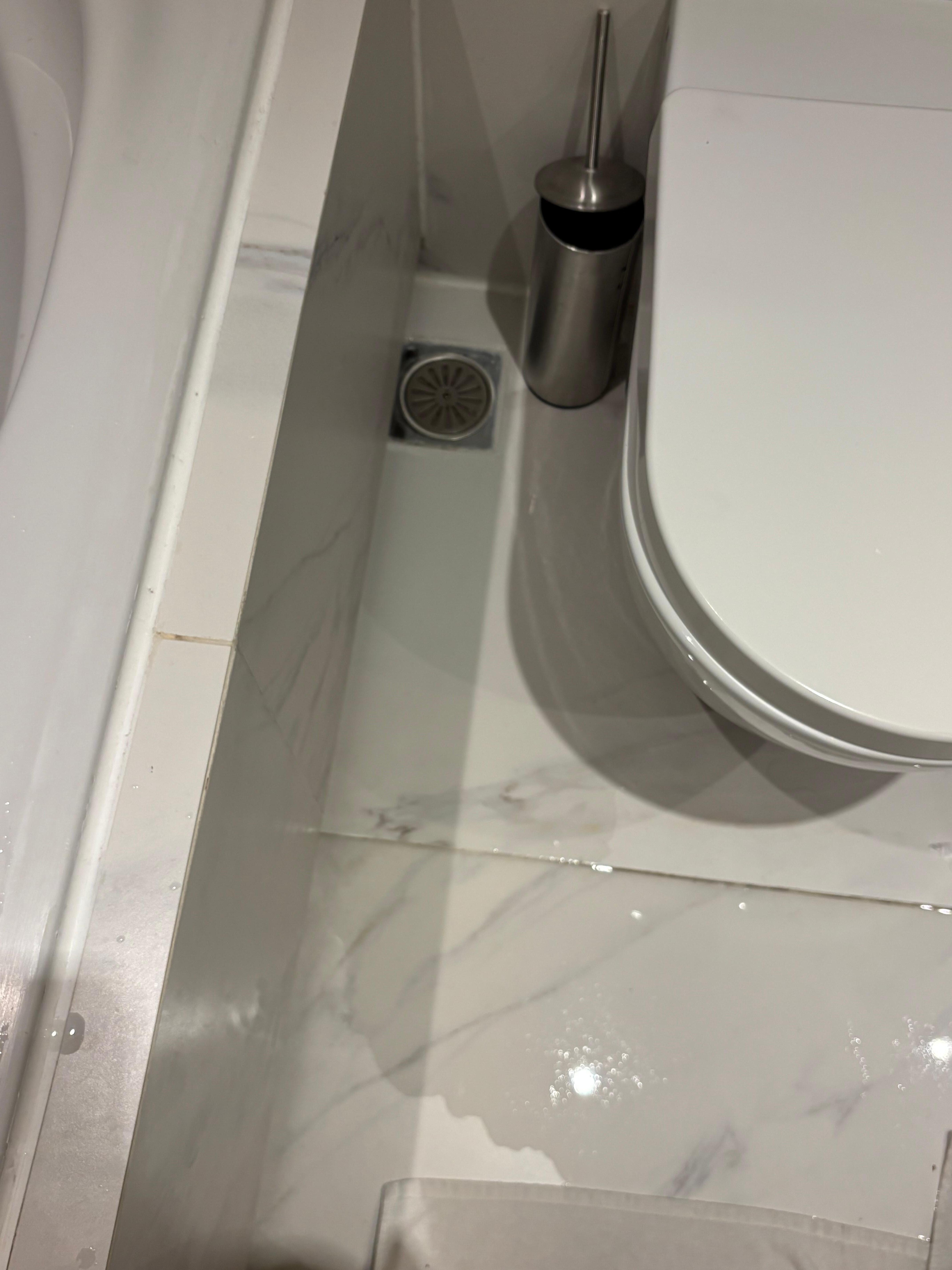 Bath water draining came back up through the floor grate
