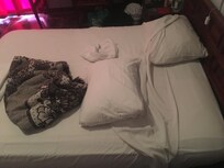 Under the pillow!? It would take seconds to spread this on the bed.