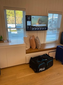 Room could use a chair bc banquette is under the TV