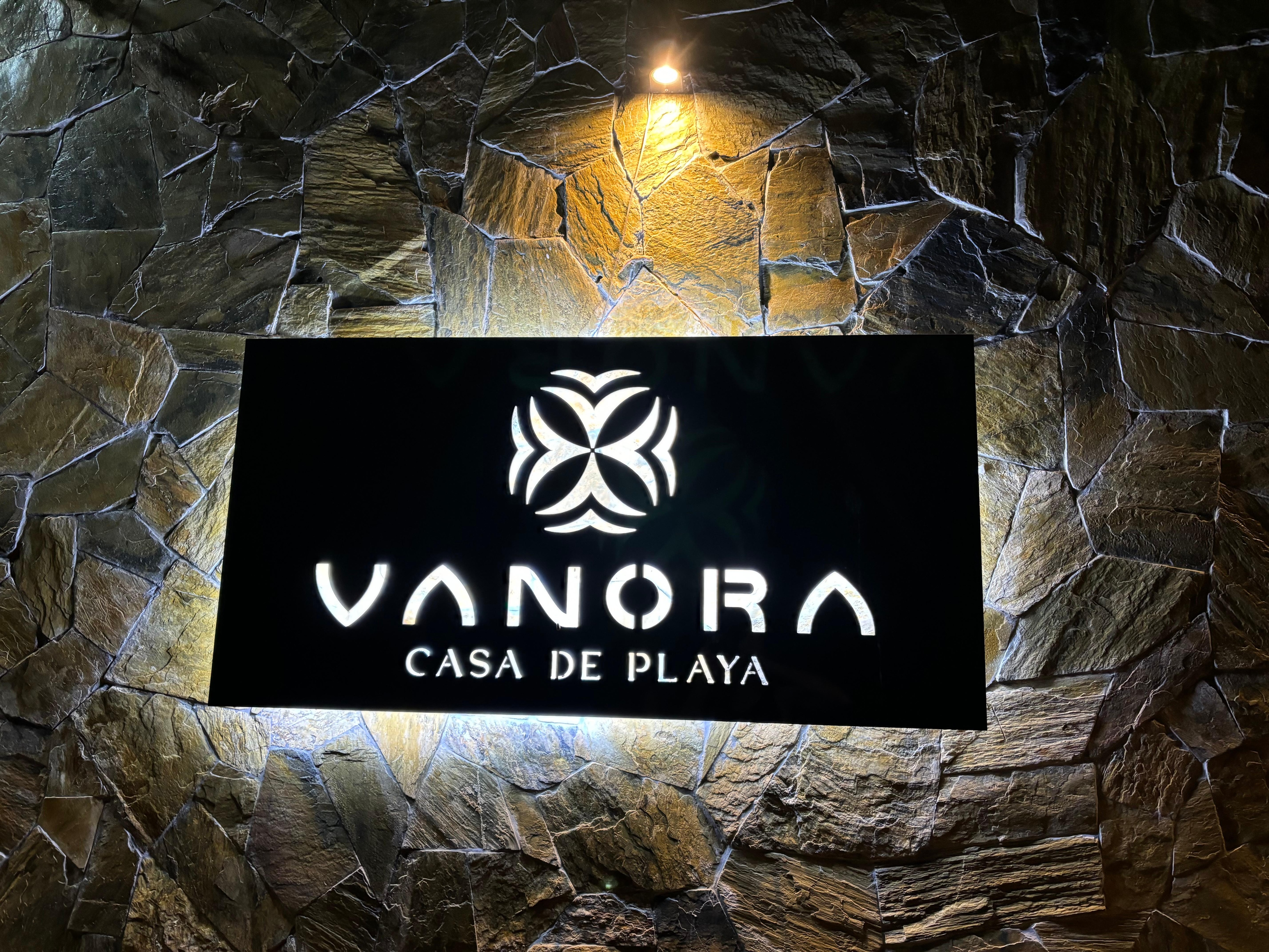 Casa Vanora sign at night 