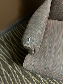 Torn chair in room