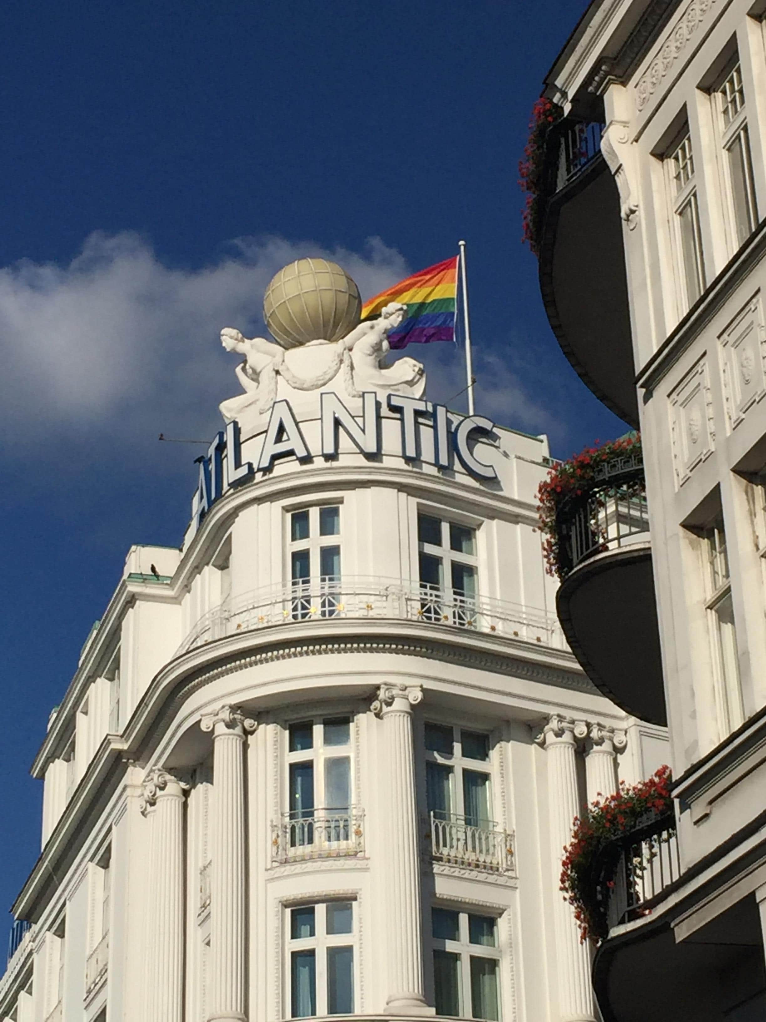 The famous globe symbol of the hotel and a rainbow flag for Pride Week