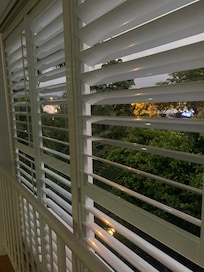 Plantation blinds on balcony for privacy