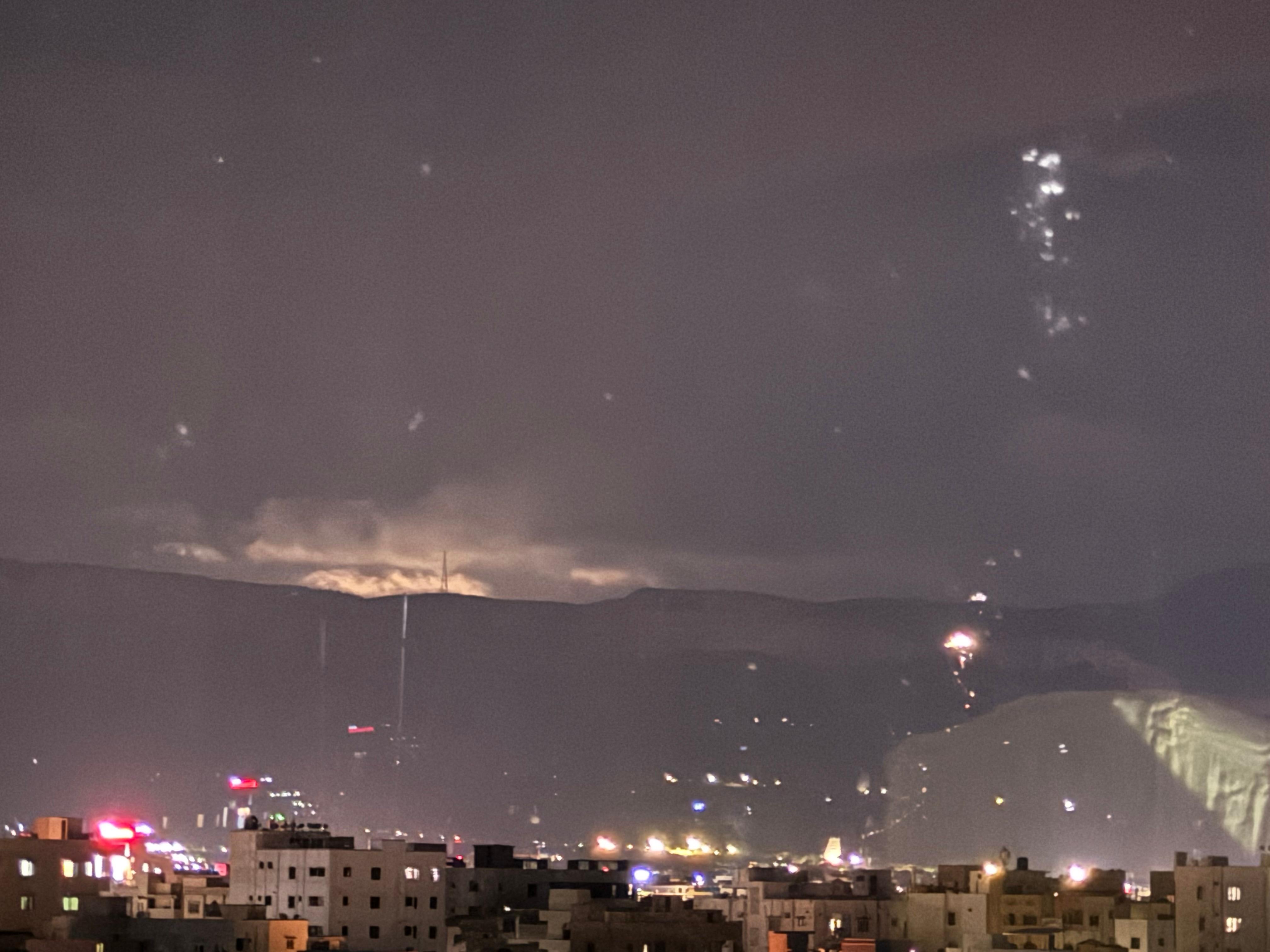 Lights of Tirumala visible behind the hills 