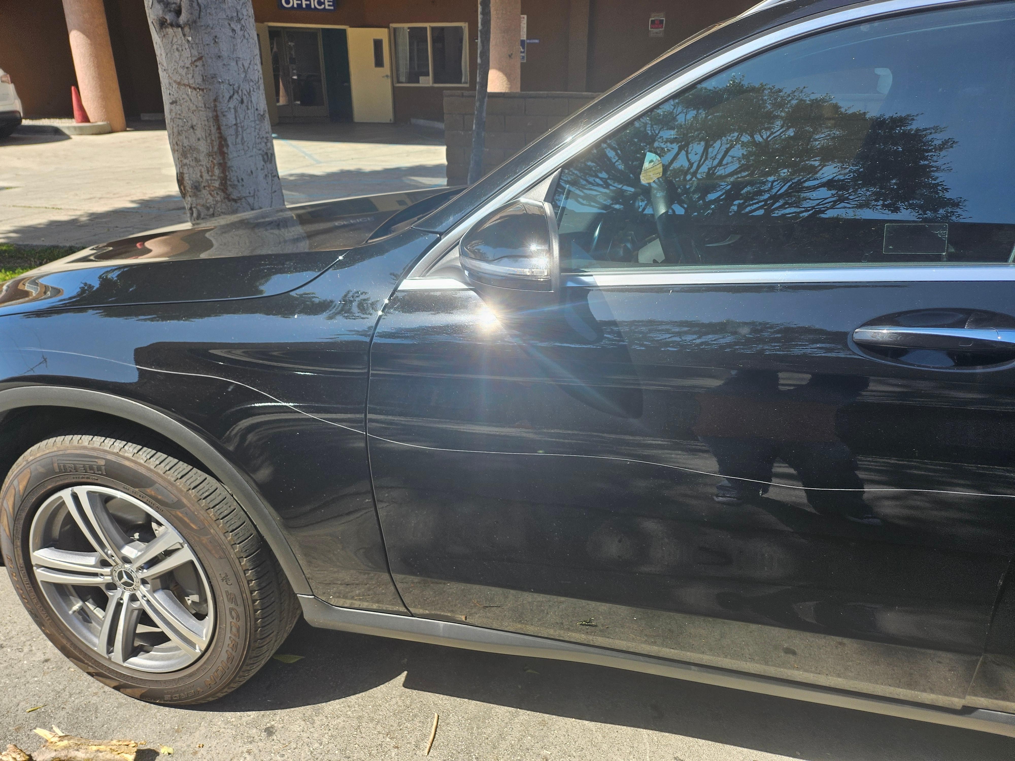 Damaged car by hotel
