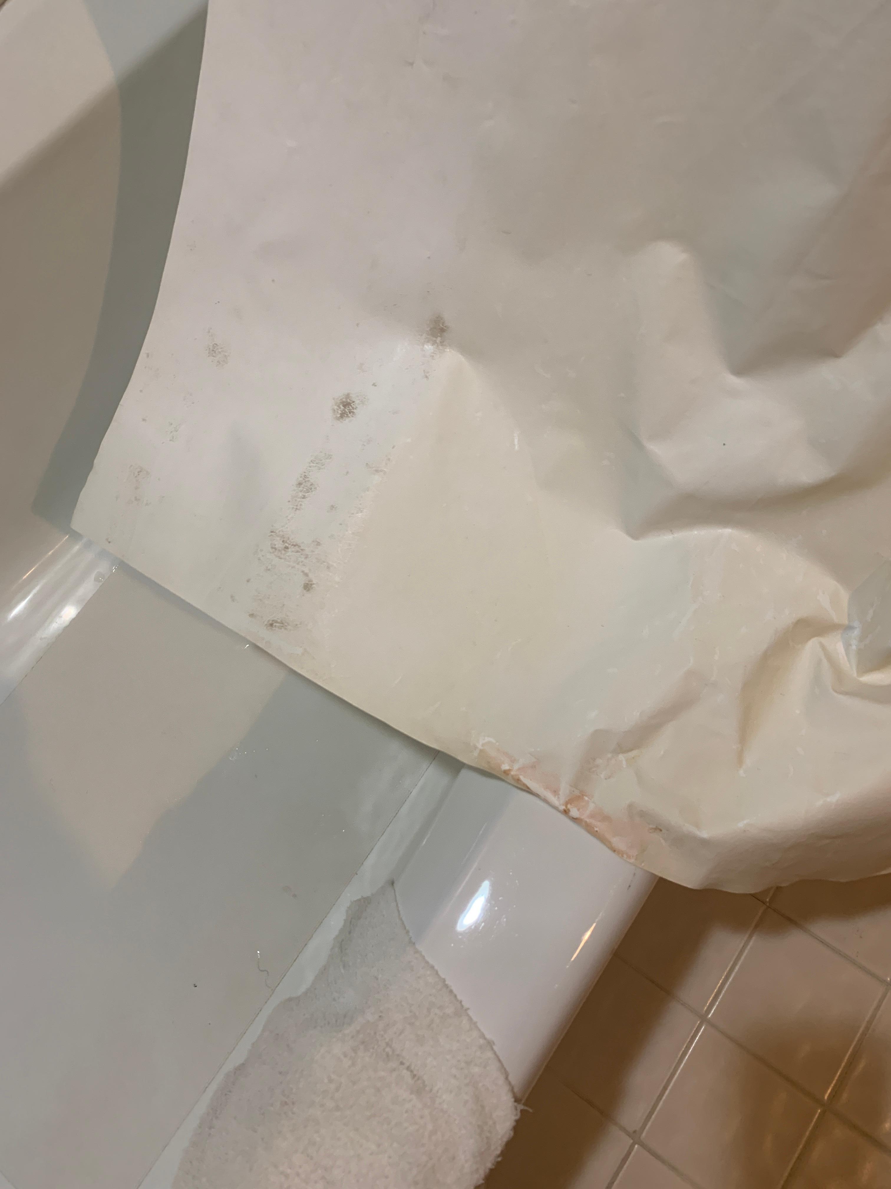 Mold and dirt on shower curtain