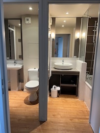 2 separate bathrooms with shower and bath tub. 1 toilet.