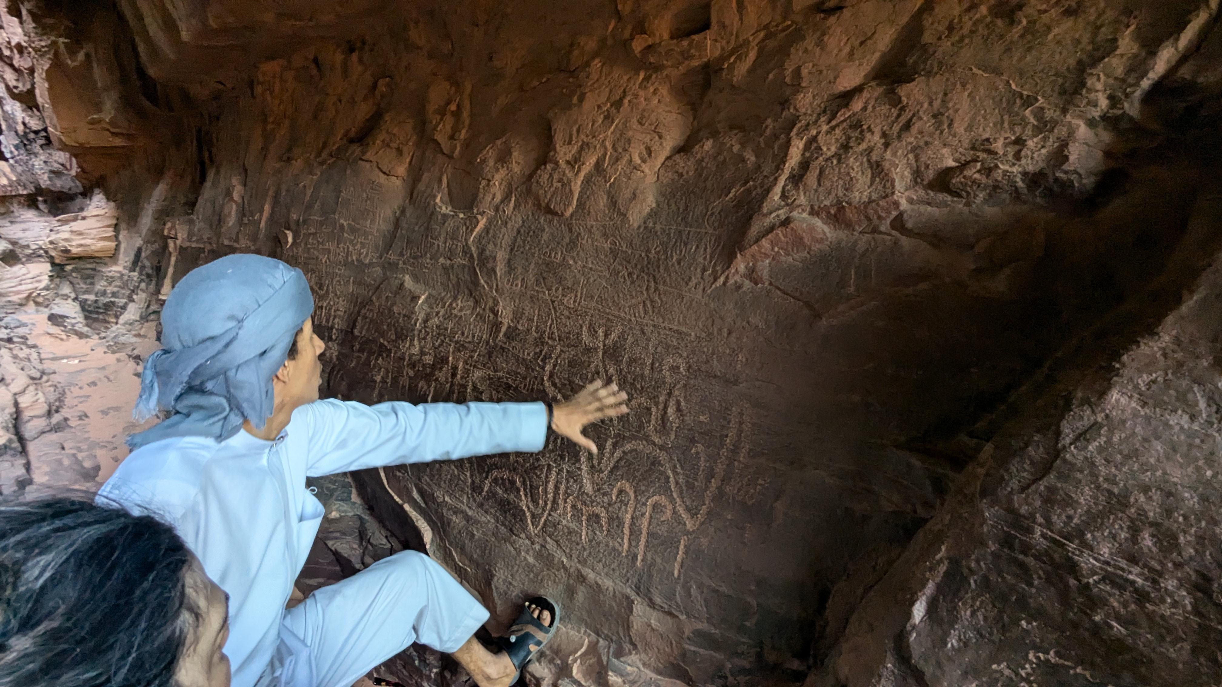 Our guide showing us Nabatean inscriptions dating back roughly two thousand years.