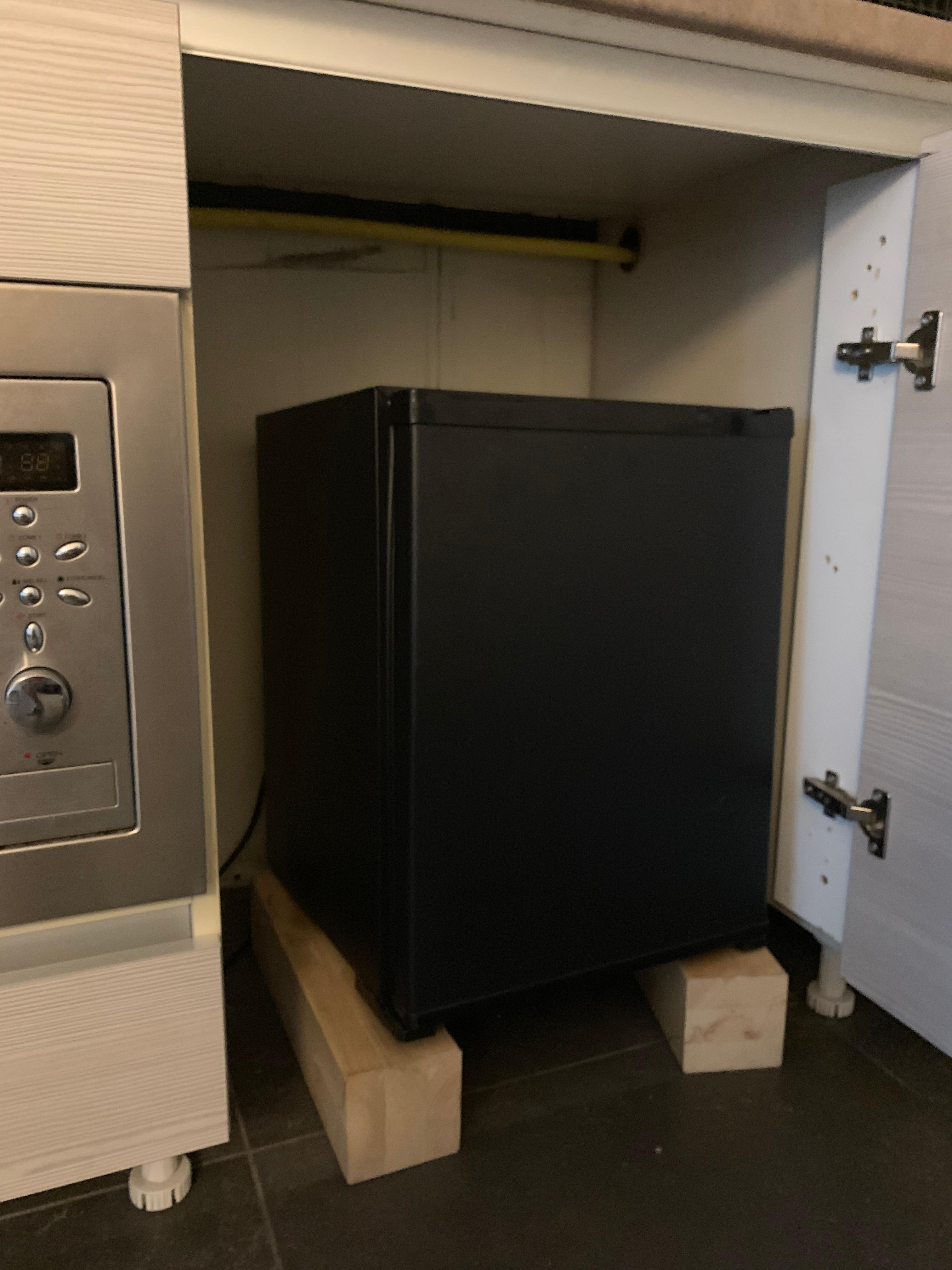 Mini fridge in wooden block