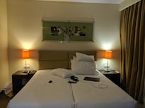 Bedside lights only with no additional sockets for your devices. Also, the bedroom section as you can see is very small. The only ceiling lights are at the entrance but not on the bed area, which makes the bedroom area very dark.