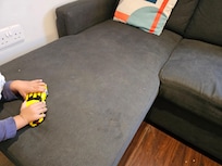 Filthy sofa bed with marks