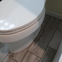 Caulk coming off toilet also disgustingly dirty floor