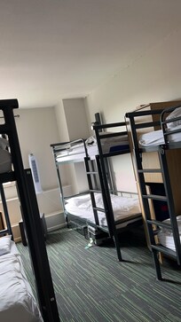 Woman and man were in the same room. One toilet and shower was out of order.