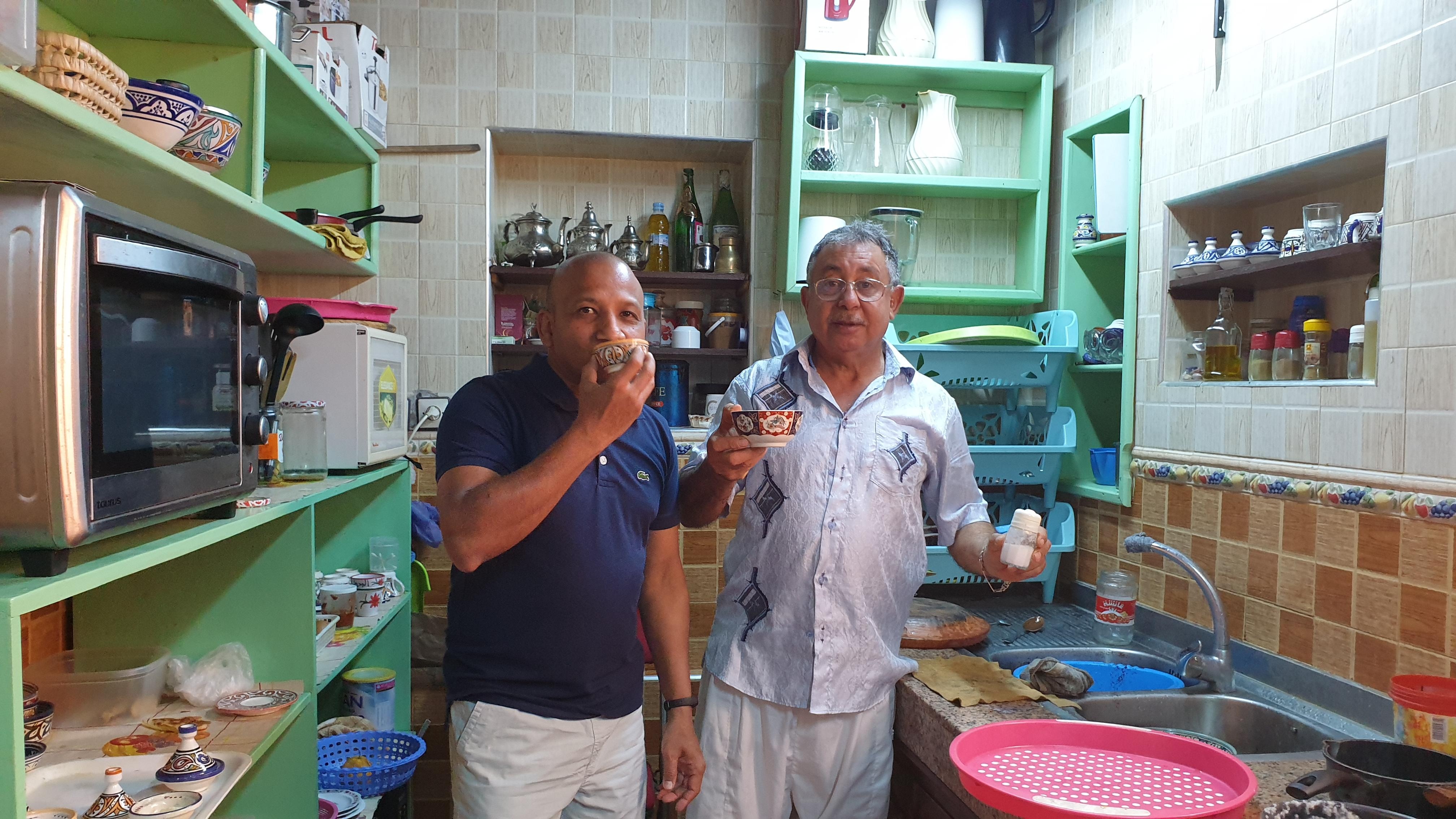Ahmed and myself eating traditional porridge like dish in the breakfast