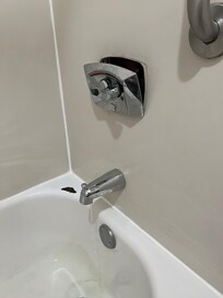 Room 305 shower. Ripped off the wall and dripping water. The shower did not work. Did not turn on as it was so damaged.