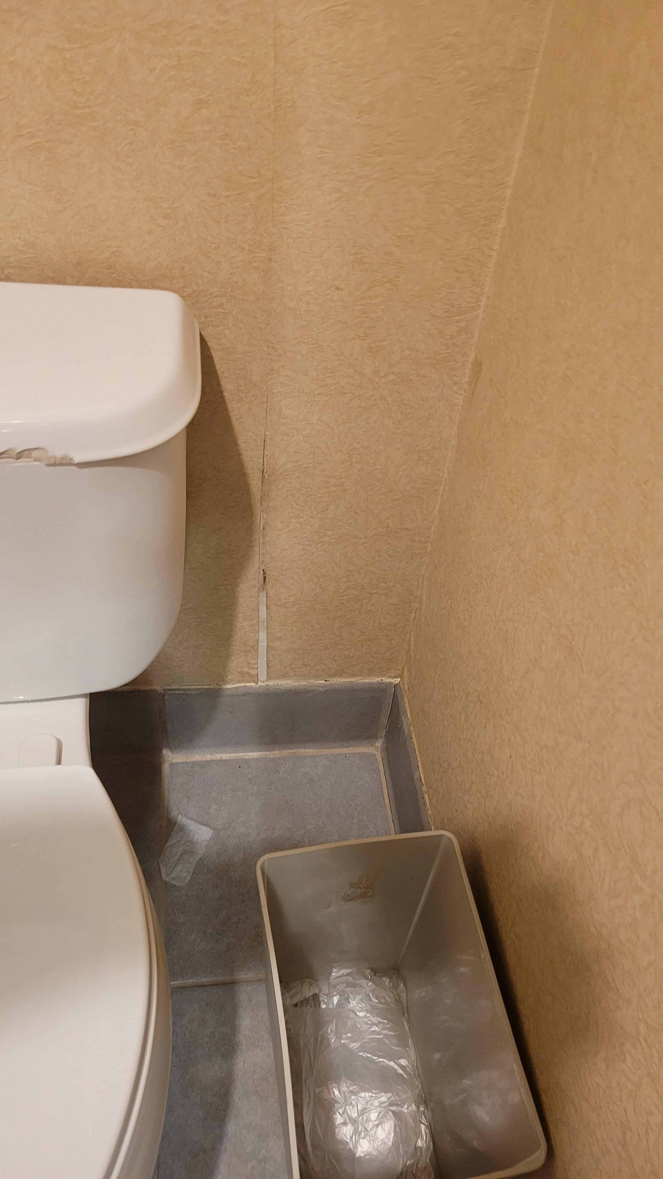 Chipped, wall paper pulled away in most places