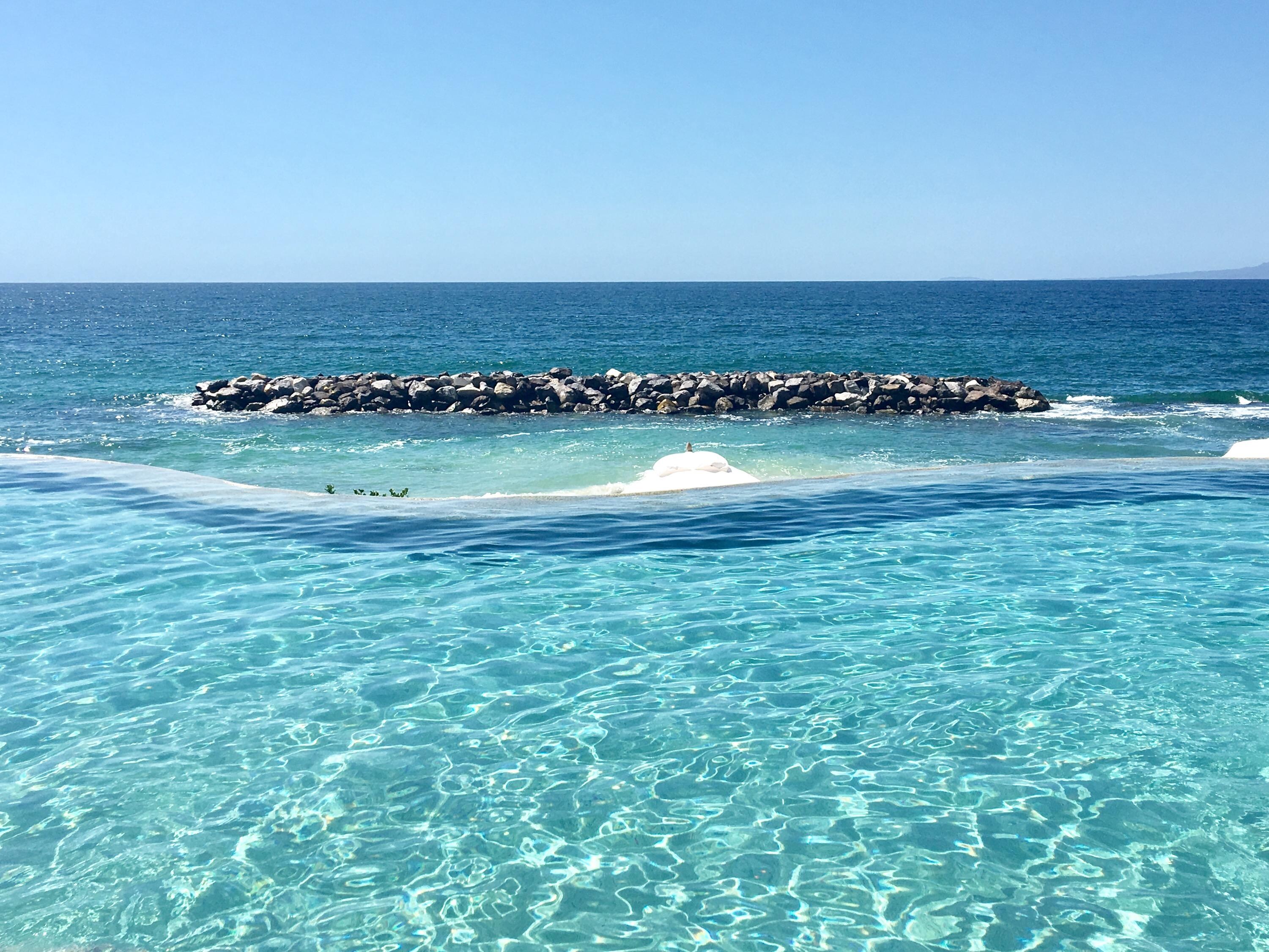 Lower pool with infinity edge overlooking the ocean