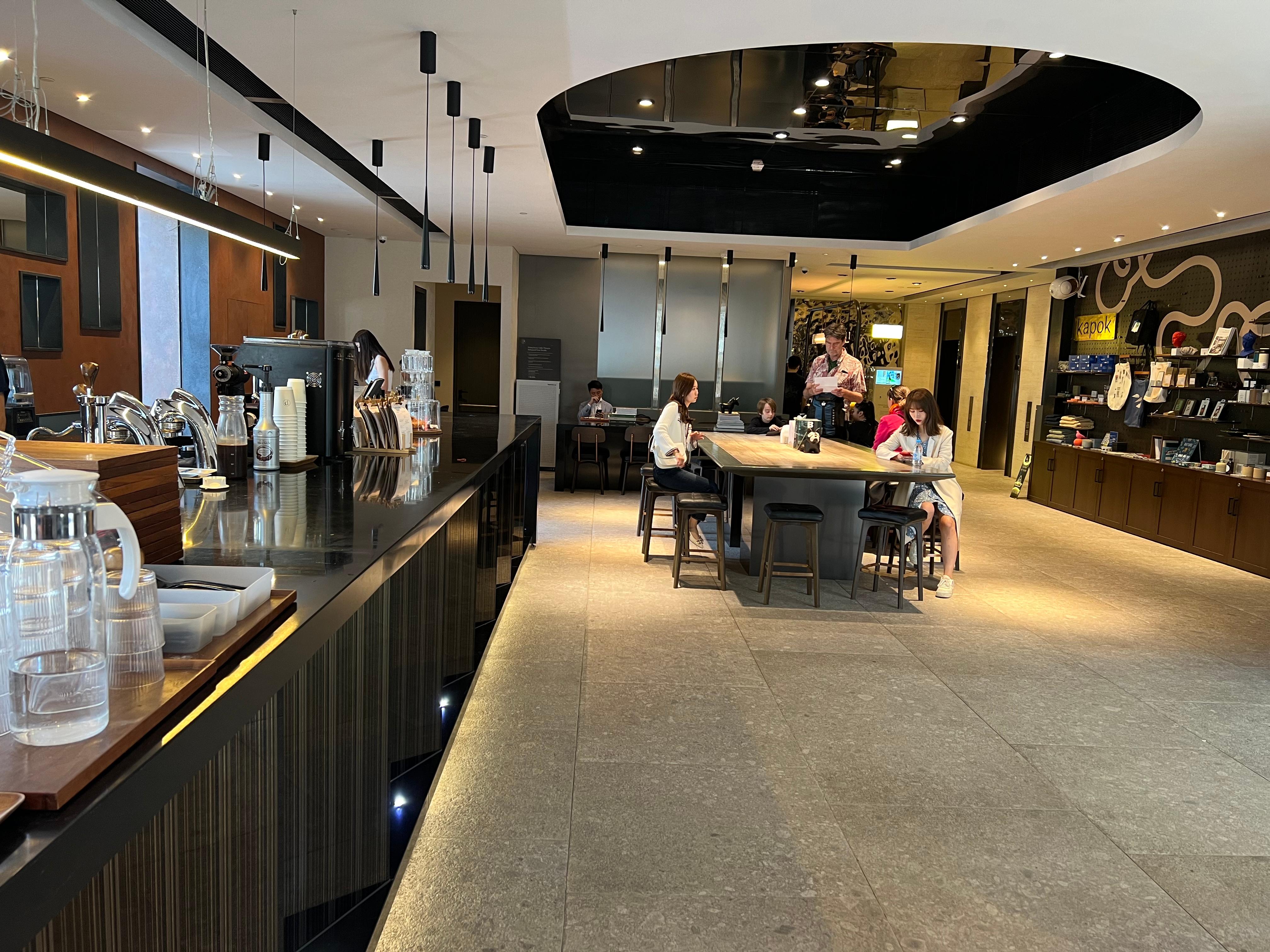 Entrance helmed by open cafe where you can get coffee and breakfast 