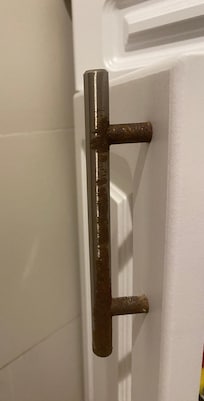 Rusty handle bathroom.