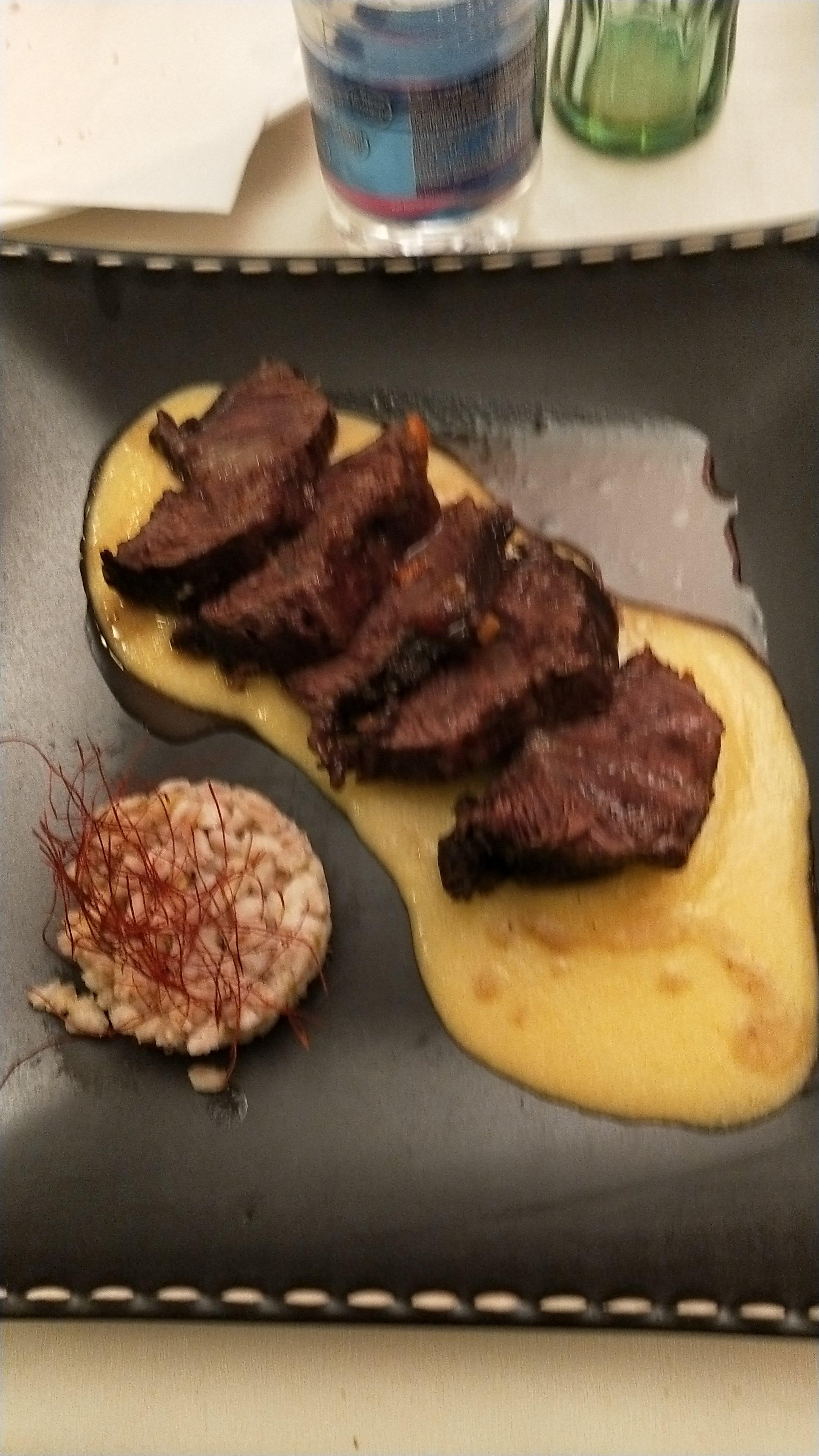 Guancia di cinghiale con polenta .
