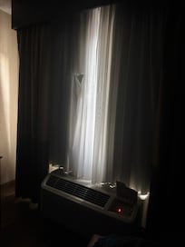 Ripped Curtain in Room